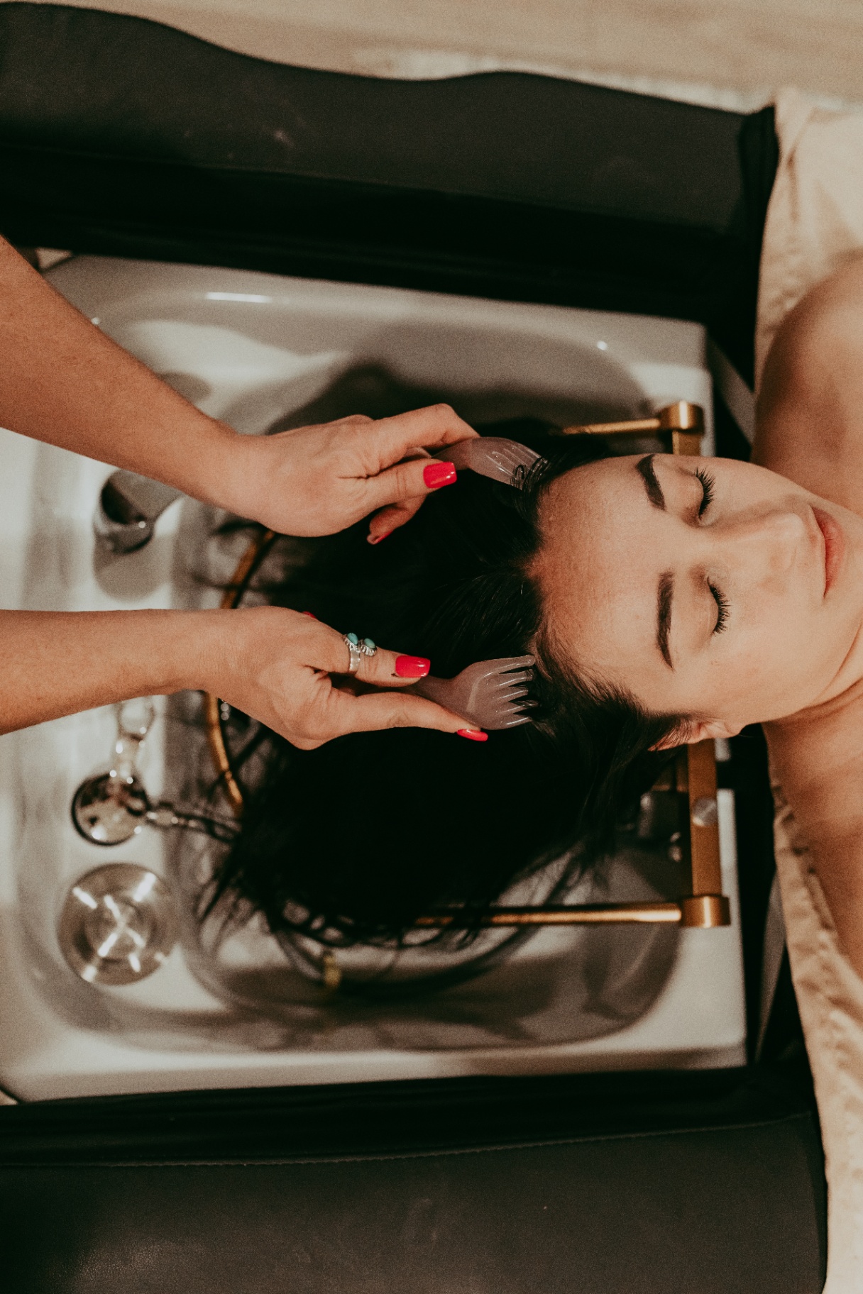 Overhead head spa treatment at Wild Roots